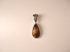 Tiger’s Essence drop pendant